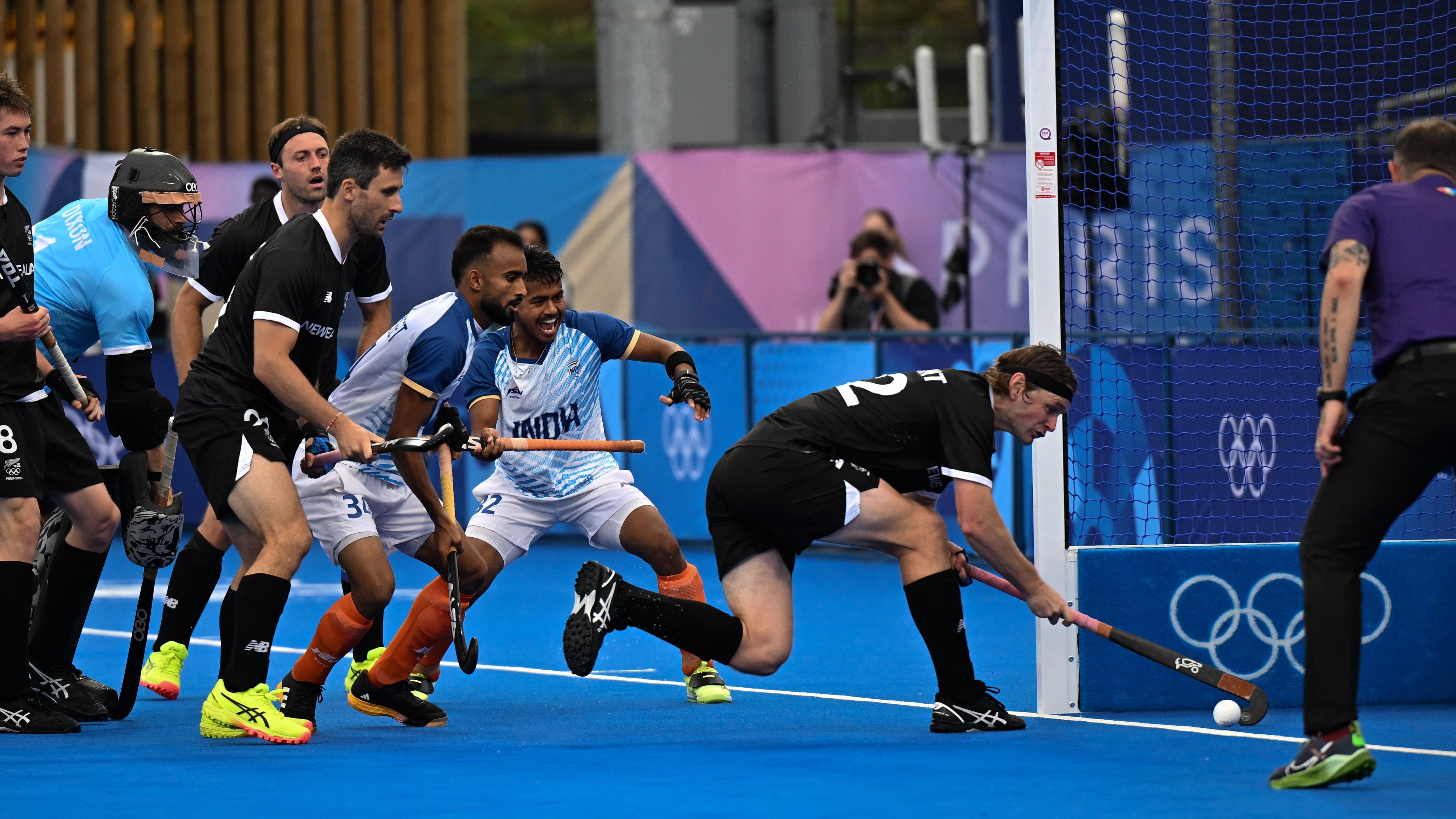 <div class="paragraphs"><p>Vivek Sagar Prasad (second from right) scores India’s second goal during their win over New Zealand in Paris on Saturday.</p></div>